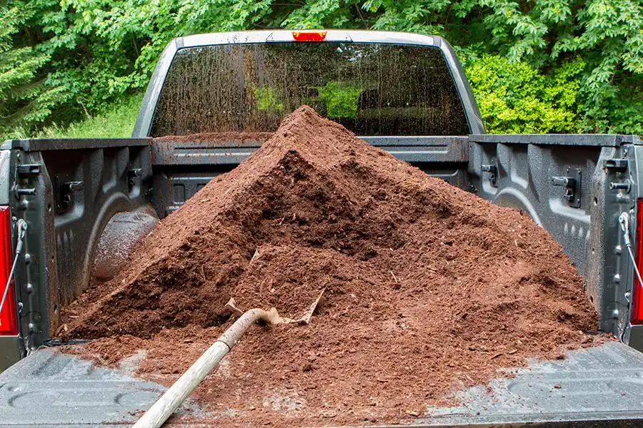 Fresh dark mulch delivered to a New Albany Country Club neighborhood driveway